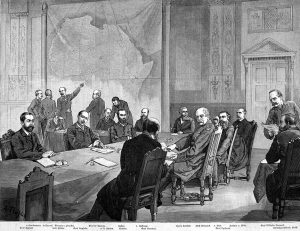 Group of men sitting around a large table