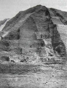 Workers mining guano on a large hill on a Peruvian island