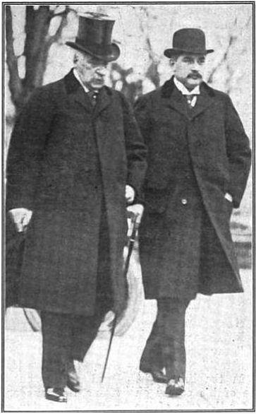 J.P. Morgan on left in top hat walking with his son Jack Morgan