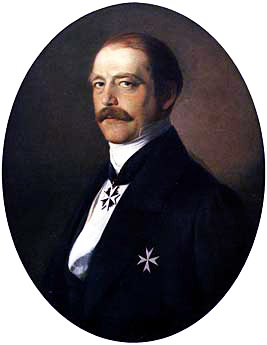 Portrait of Otto von Bismarck in dark suit wearing insignia of a knight of the Johanniterorden