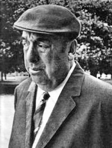 Photographic portrait of Pablo Neruda in hat and suit