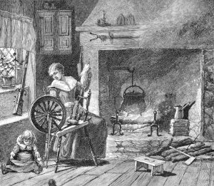 Woman working at spinning wheel in front of a fire with a child at her feet
