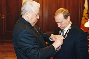 President Boris Yeltsin handing the Presidential Emblem to Vladamir Putin