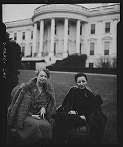 Eleanor Roosevelt seated next to Madame Chiang Kai-shek on lawn in front of White House
