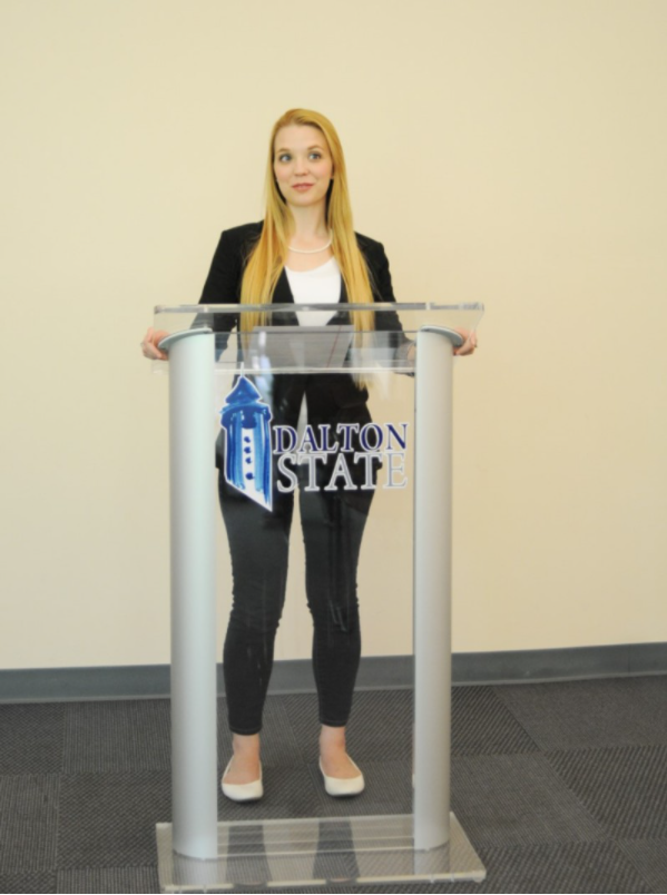 Student standing at podium