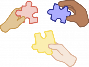 hands holds puzzle pieces
