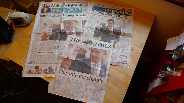 Three news papers on a table (The Daily Telegraph, The Guardian, and The Times), all predicting Obama has the edge in the early polls.