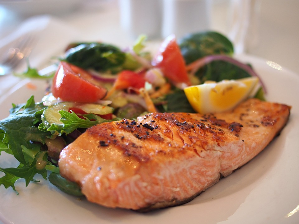 Plate of grilled salmon with a salad