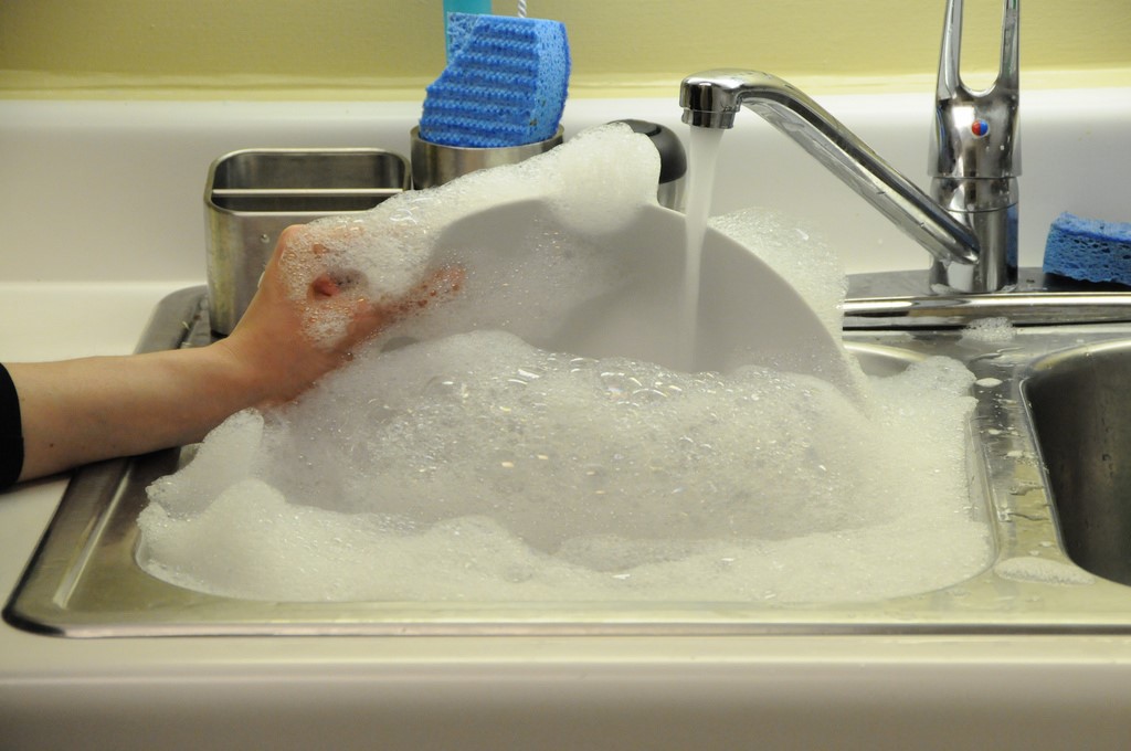A sink of soapy water and dishes