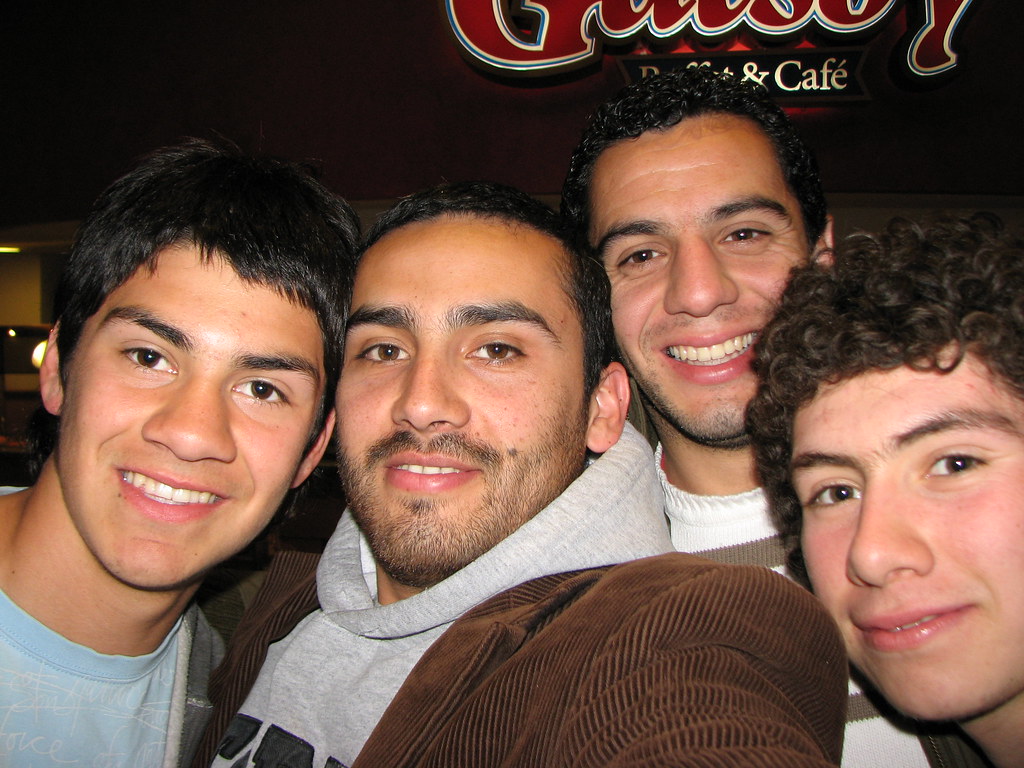 Four friends smiling on a night out