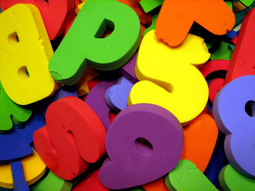 Foam letters and numbers meant for children to play with in the bathtub.