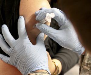 Photo of person receiving an injection.