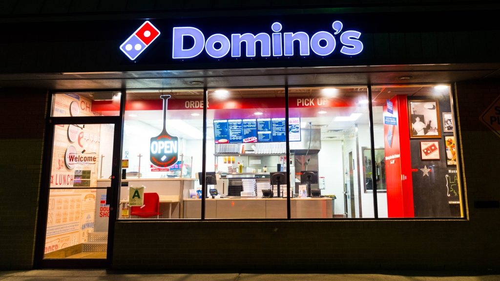 Domino's storefront at night.