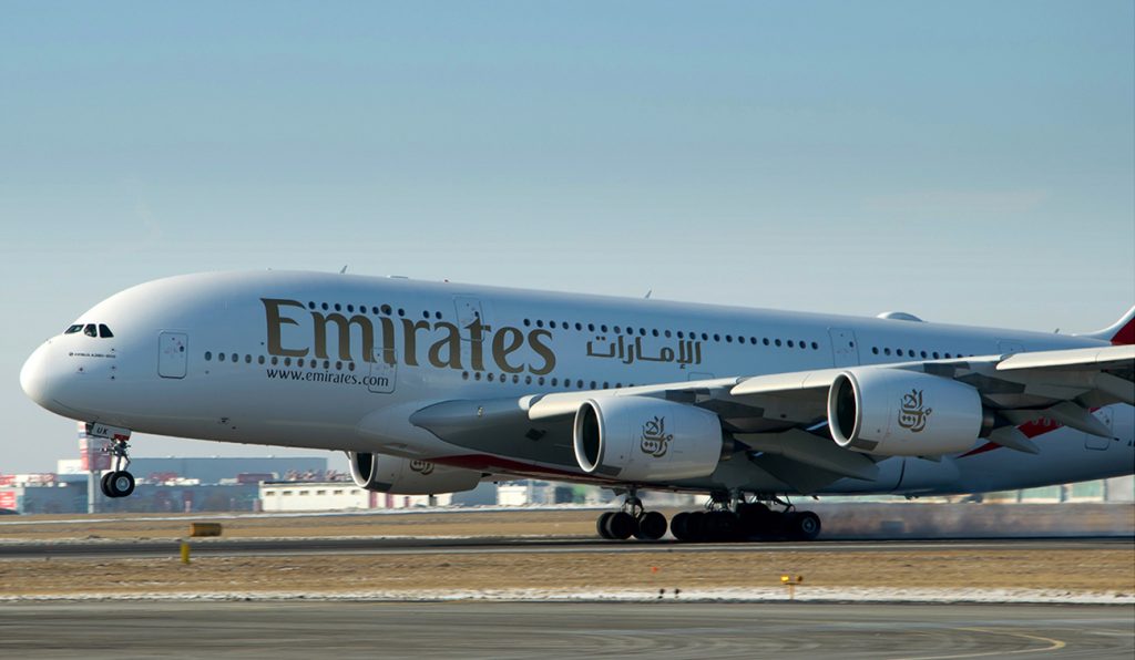 Emirates airplane on runway.