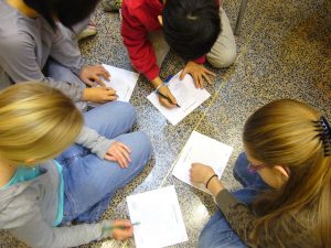 A group of students work together on an assignment