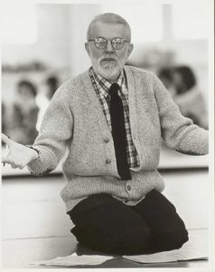 Photo of Robert Dunn kneeling on the flor.