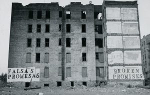 A photo of an old multi story buidling in a state of collapse.