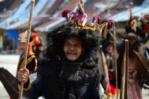 Color image of a a war dancer from South Nias