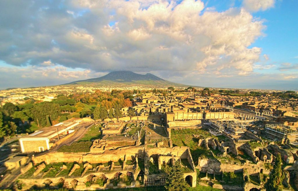 Ruins of Pompeii from above, with Vesuvius in the background