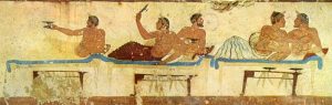 Ancient greek fresco of men lounging on couches.