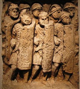 Wall carvings of a Roman legion in battle