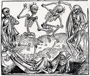 Three skeletons dancing while one skeleton plays music and another skeleton lays on the ground.