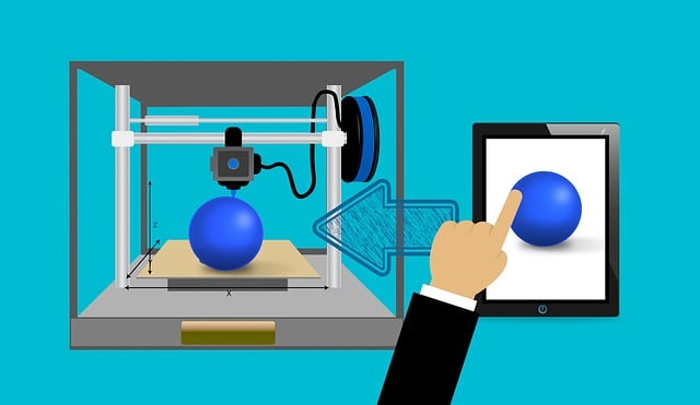 A photo of a 3-d printing technology, printing a blue ball.
