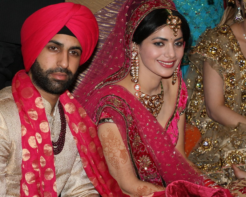 Photo of a Sikh couple at their wedding.