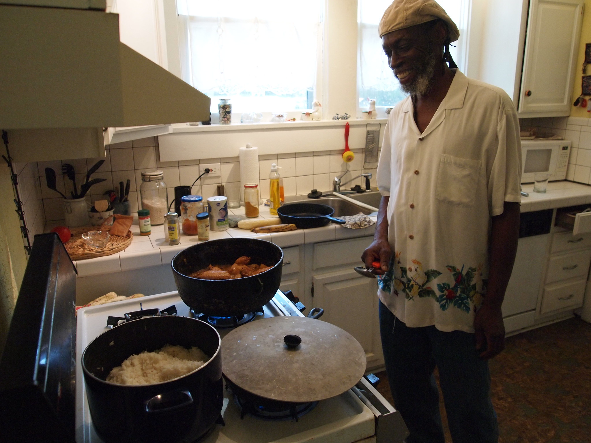 Photo of Gordon Nurse of Burning Spear Cafe cooking in his home kitchen in Highland, a neighborhood of Shreveport, Louisiana.