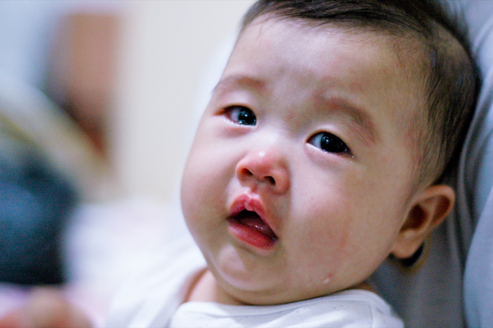Baby with tear running down face
