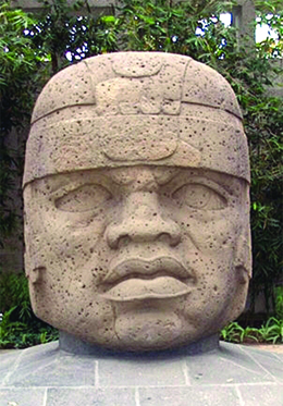 A photograph shows a massive carved stone head.