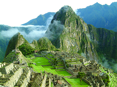 A photograph of Machu Picchu shows the ruins of a complex of buildings with stone walls.