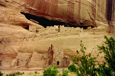 A photograph of Anasazi cliff dwellings shows blocky adobe structures with window and door openings.
