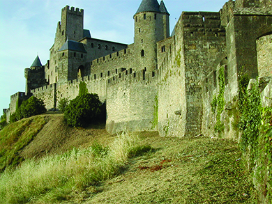 A photograph shows the medieval walled city of Carcassonne.