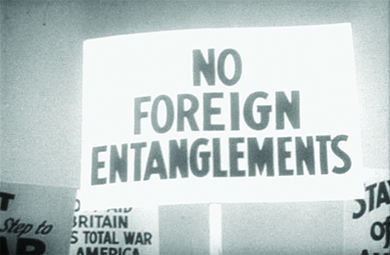 A protest sign reads “NO FOREIGN ENTANGLEMENTS.”